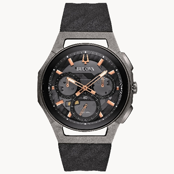 Five-hand Curved Chronograph in Titanium and Stainless Steel Case with Black Bezel; Dark Grey Exhibition Dial with Rose Gold-tone Accents; Exhibition Caseback; Curved Sapphire Crystal; Black Rubber Strap from the CURV Collection Featuring High Perfor