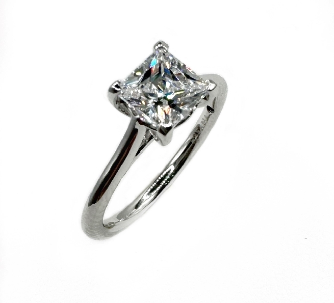 0.02ctw Diamond VS-SI Clarity; FG Colour Princess Cathedral Solitaire with Bezel Set accent Diamonds set with Square Cubic Zirconia Centre and Blue Sapphire Signature Stone 14K White Gold Ring Mount by Fana