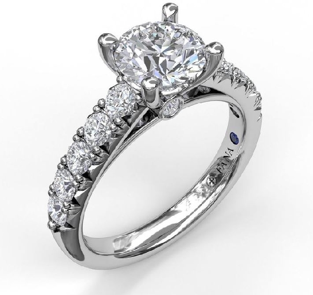 0.63ctw Diamond VS-SI Clarity; FG Colour Round French Pave Single Row Solitaire with Bezel Set accent Diamonds set with Round Cubic Zirconia Centre and Blue Sapphire Signature Stone 14K White Gold Ring Mount by Fana