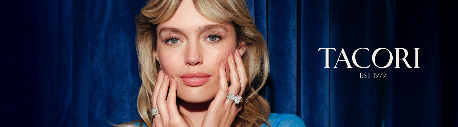 woman holding hands up to her face with Tacori diamond rings on each hand's ring finger